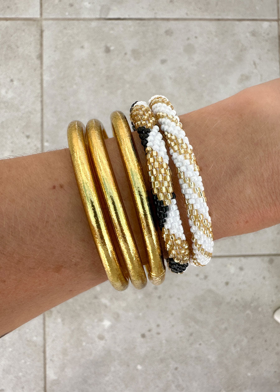 Lot joncs bouddhistes et bracelets népalais - light gold